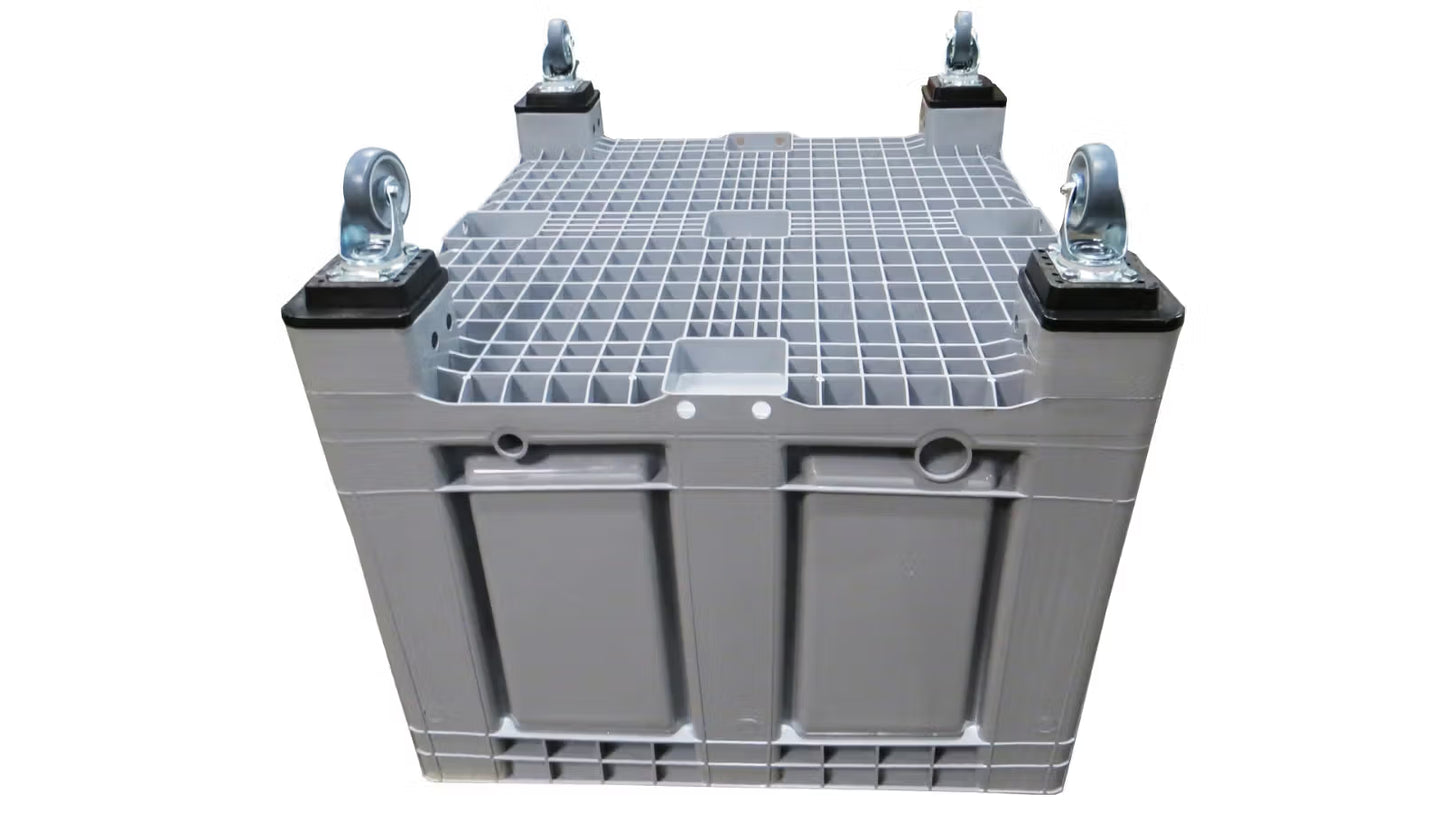 Skrzyniopaleta plastikowa pełna szara na stopach i kołach wym. 1200x1000x790 mm